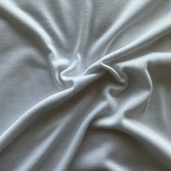 Kierrätetty puuvillainen neulottu kangas